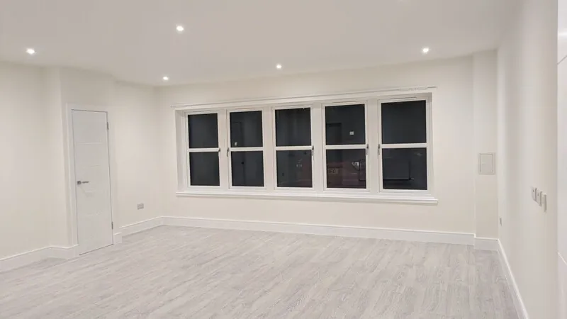 Freshly renovated room with recessed lighting