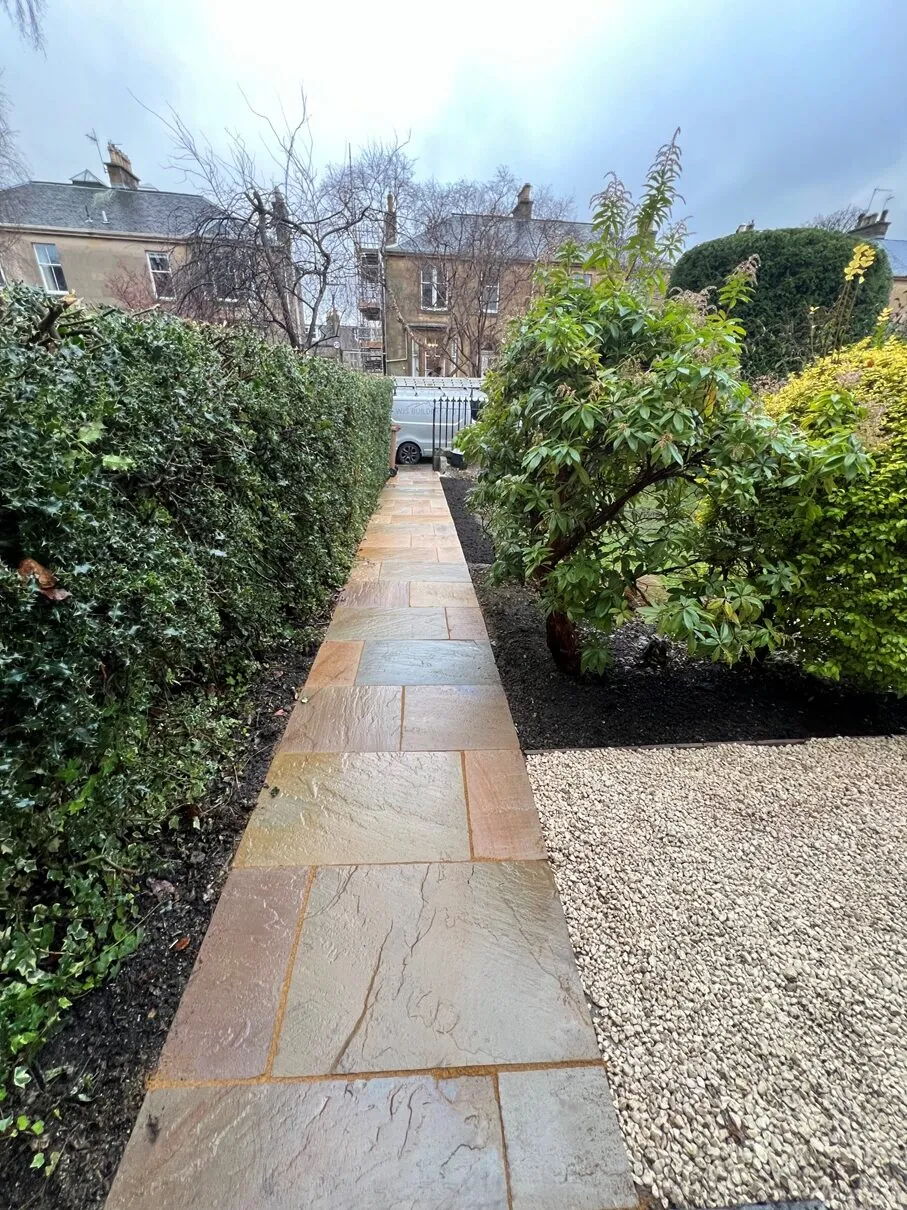 New stone pathway through a garden